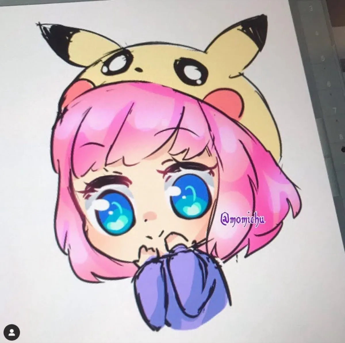 Drawing of a wide-eyed pink-haired character peeking out of a yellow hood with pointed black-tipped ears, signed at momichu
