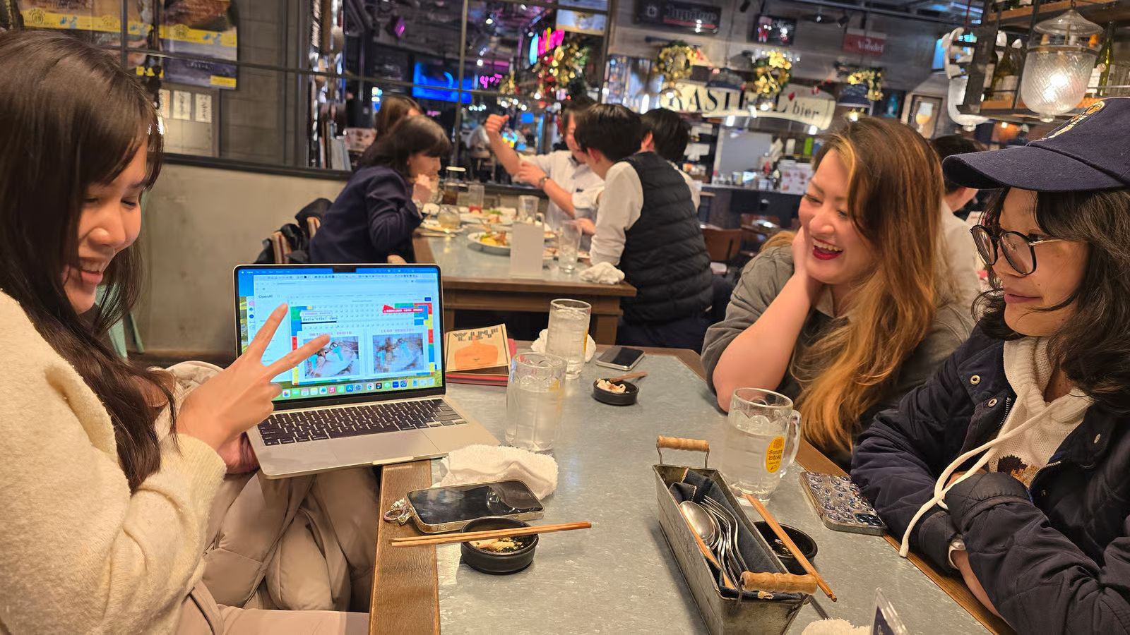 A full room of attendees at tables during a Vibe Coders Tokyo meetup