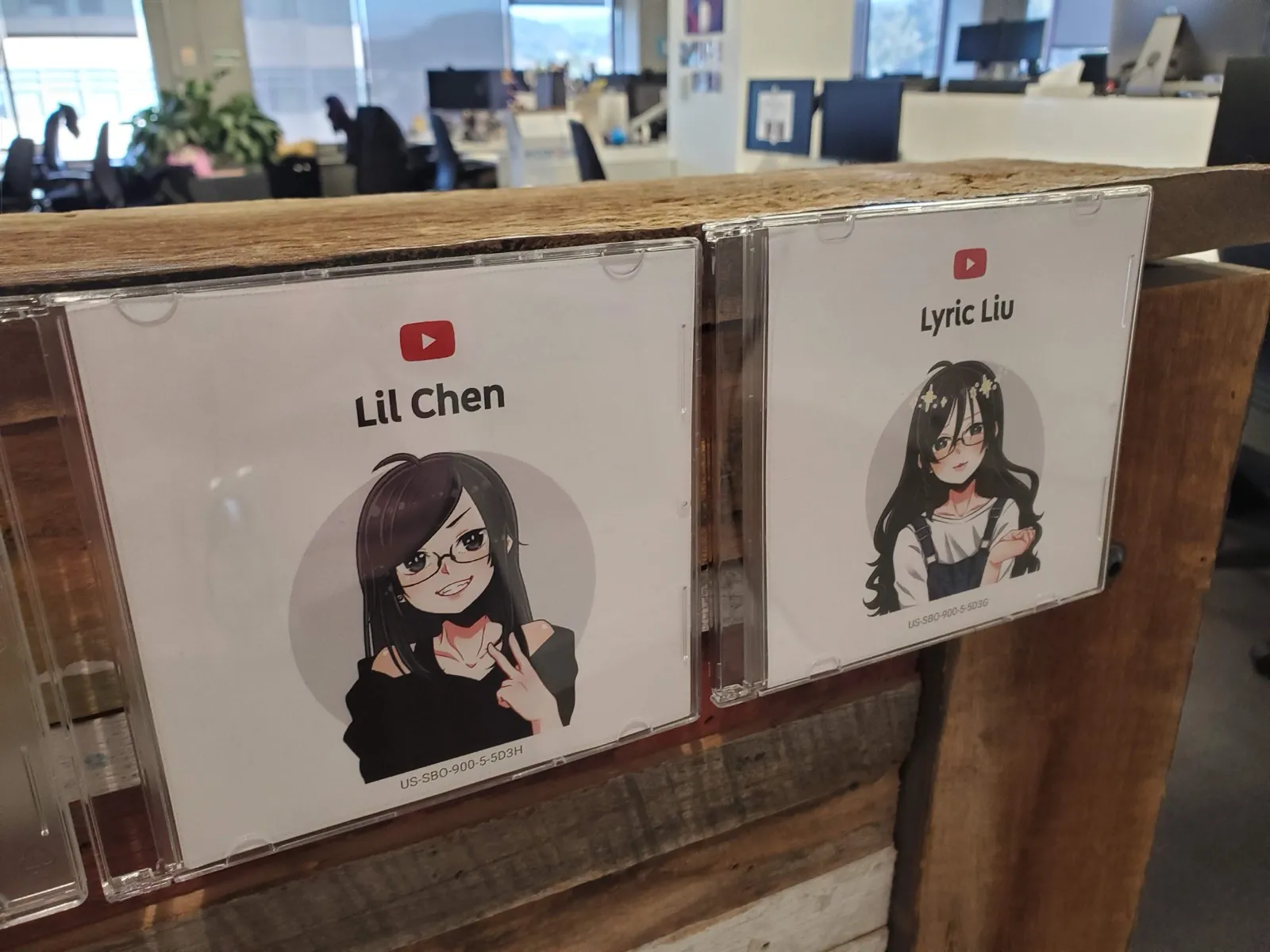 Two more anime avatar badges in CD jewel cases on the shelf, labelled Lil Chen and Lyric Liu